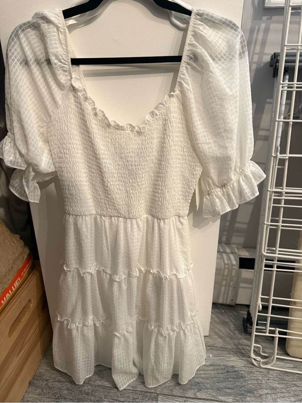 B. Smart White Ruffled Mini Dress with Smocked Neckline